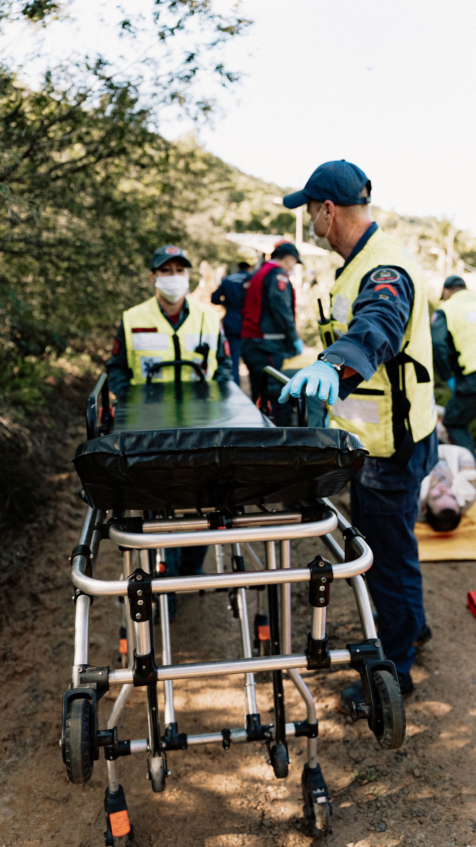 Rescue team preparing a stretcher during a medical simulation